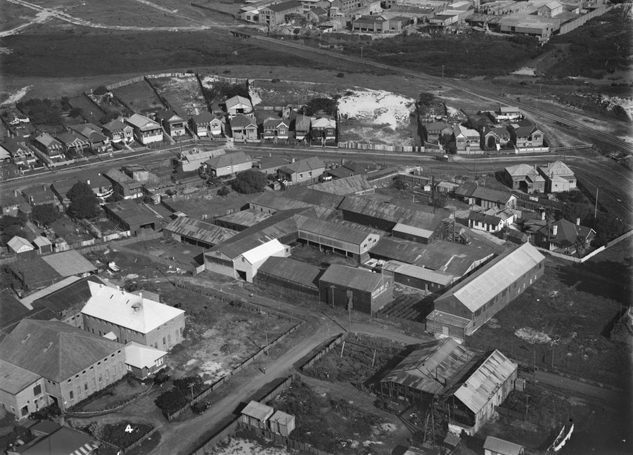 Aerial view over an industrial and residential block, with Norton Bros factory sheds — photograph, circa 1930