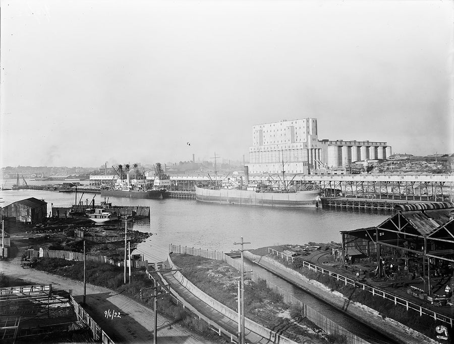 Glebe Island wheat silos and wharves, 1922 — photograph, from Rozelle, circa 1922