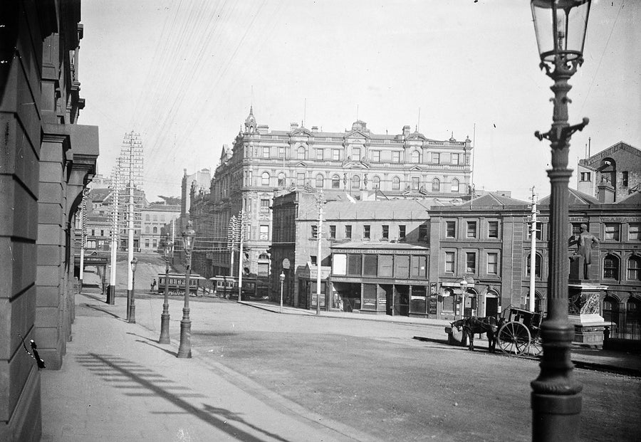 Sydney street with tram, horse-drawn cart and public statue — photograph, from Surry Hills, circa 1900