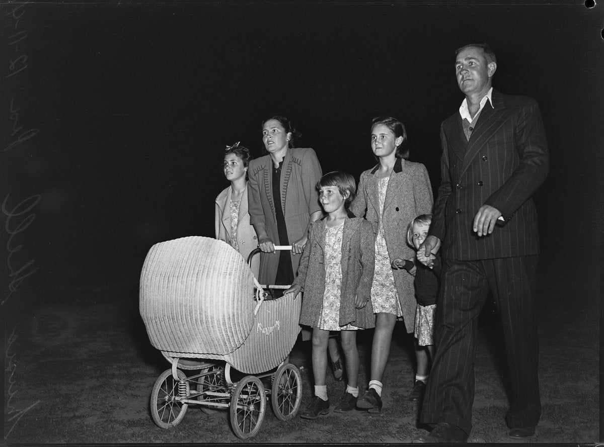 Family with a wicker pram at night, North Sydney Music Shell, 1948 — photograph, from St Leonards Park (North Sydney Music Shell), North Sydney, circa 1948