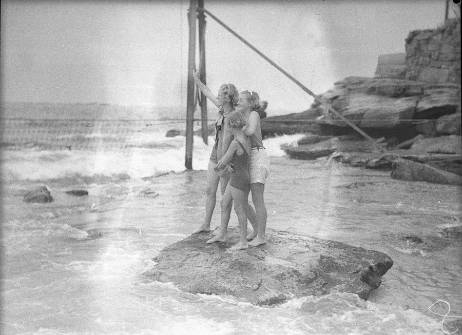 Bathers on the rocks at Coogee Beach, 1936 — photograph, from Coogee Beach, circa 1936