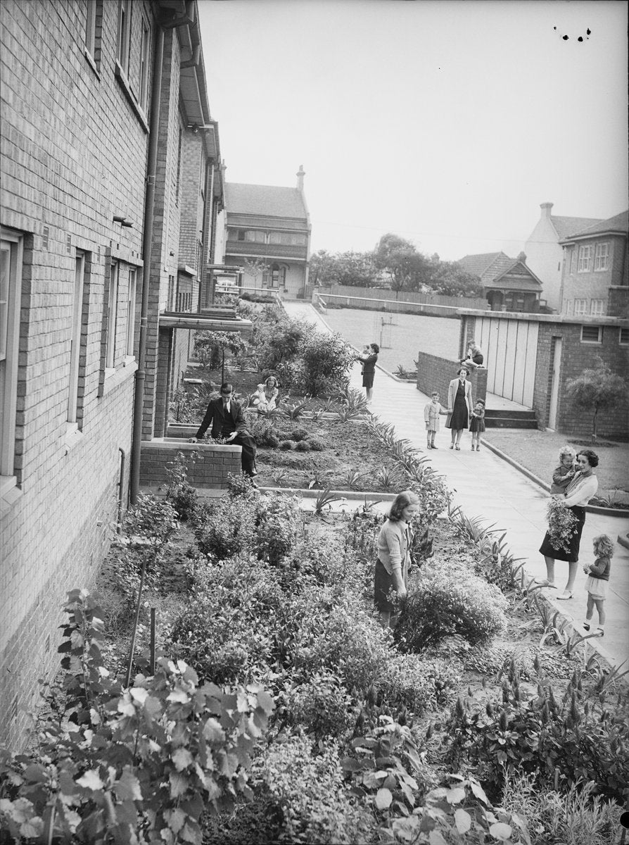 Residents in the garden of an Erskineville flat block, 1940 — photograph, from Erskineville, circa 1940