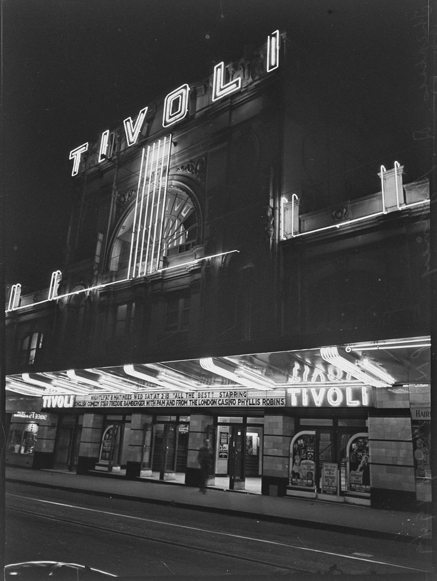 Neon-lit Tivoli Theatre frontage at night, Hay Street, Sydney, 1949 — photograph, from New Tivoli Theatre, Hay Street, Haymarket, Sydney, circa 1949
