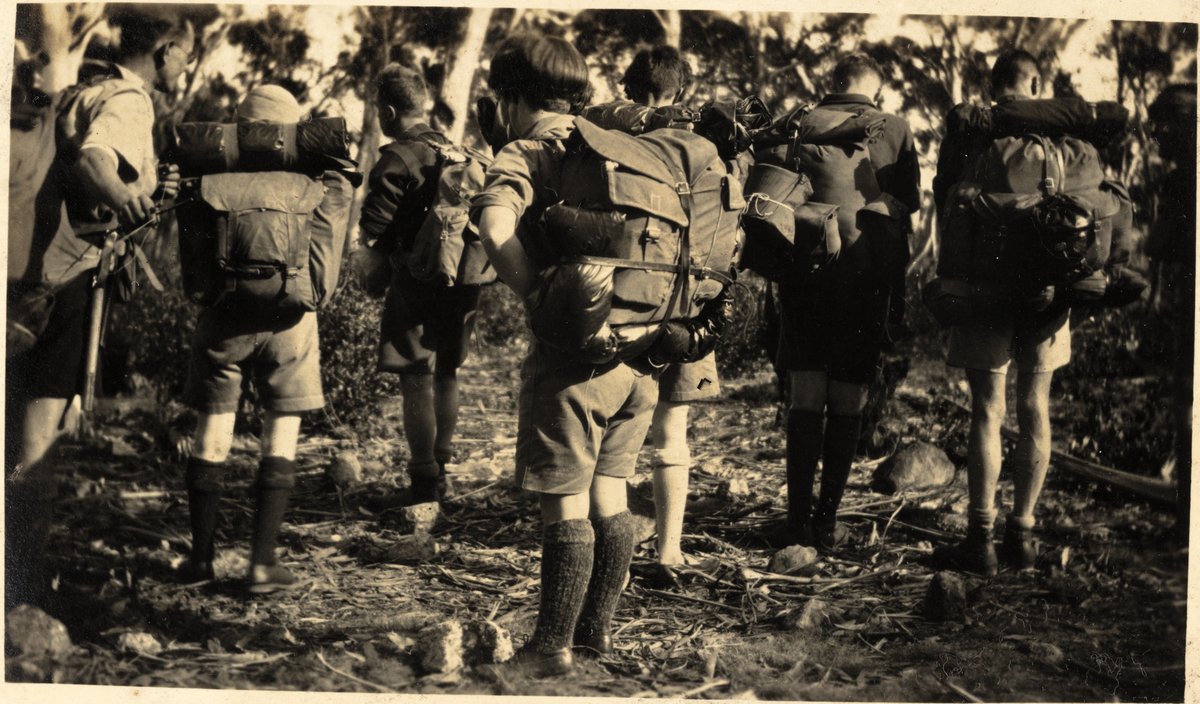 Bushwalkers carrying full rucksacks on the Jenolan to Wombeyan Caves track — photograph, circa 1928