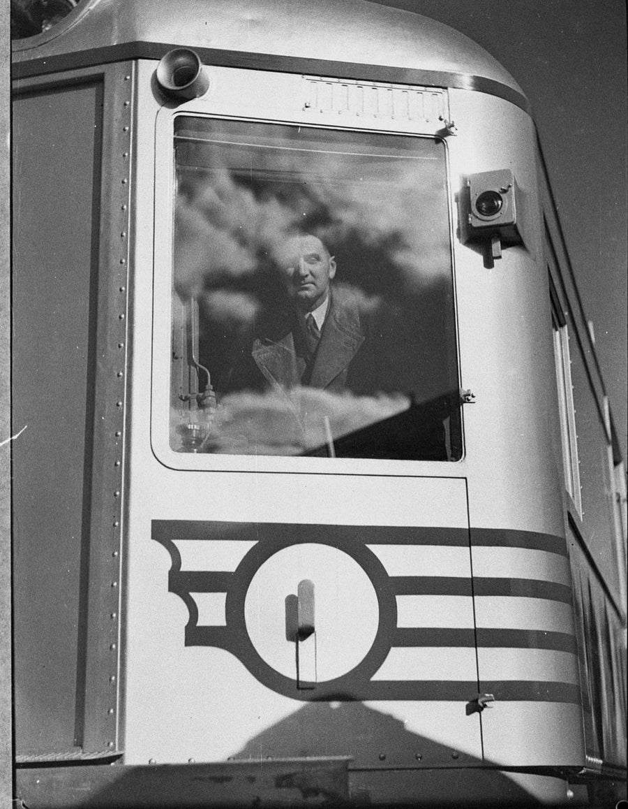 Silver City Comet driver at the cab window on its Moss Vale trial run, 1937 — photograph, from Quay Street, circa 1937