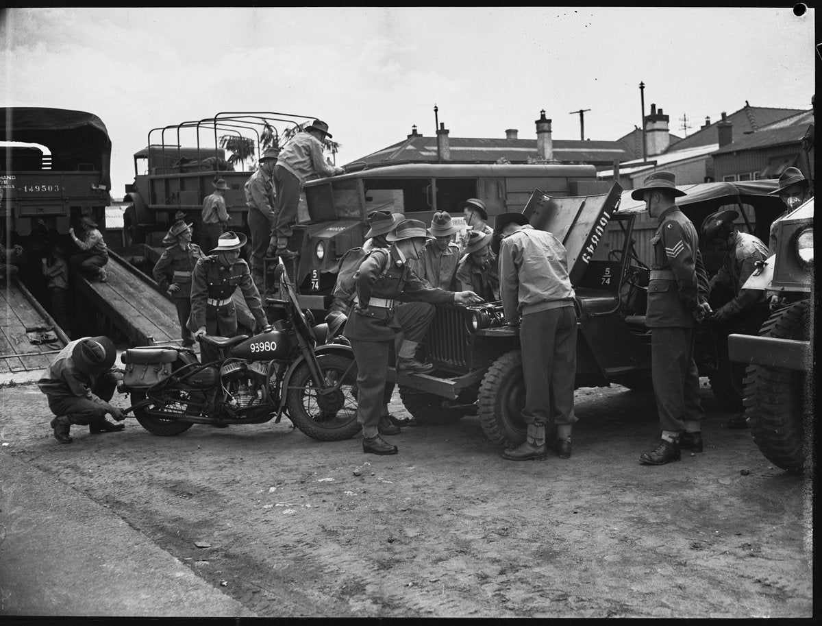 First-day army recruits around jeeps and a motorcycle, Marrickville depot — photograph, from Marrickville Army Depot, Addison Road, Marrickville, circa 1948