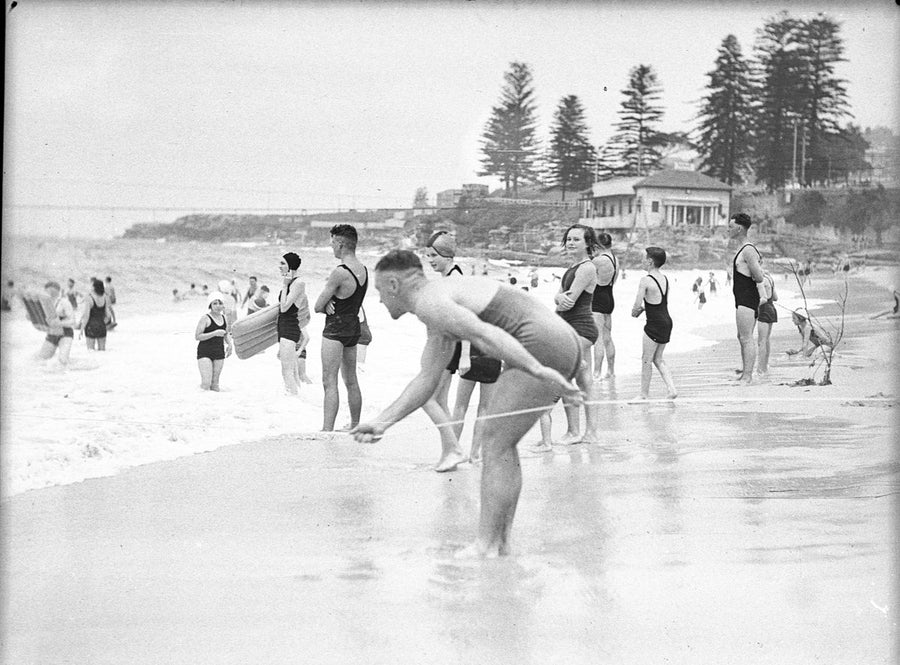 Surf bathers and a lifeline at Coogee Beach — photograph, from Coogee Beach, circa 1936