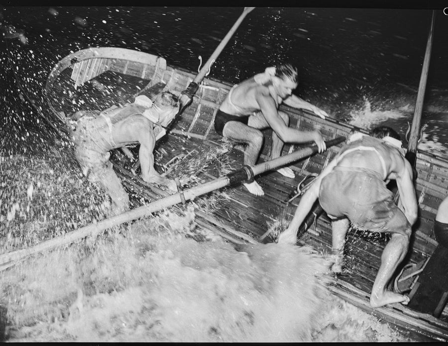 Coogee surf boat crew battling the swell at night, 1946 — photograph, from Coogee Beach, circa 1946