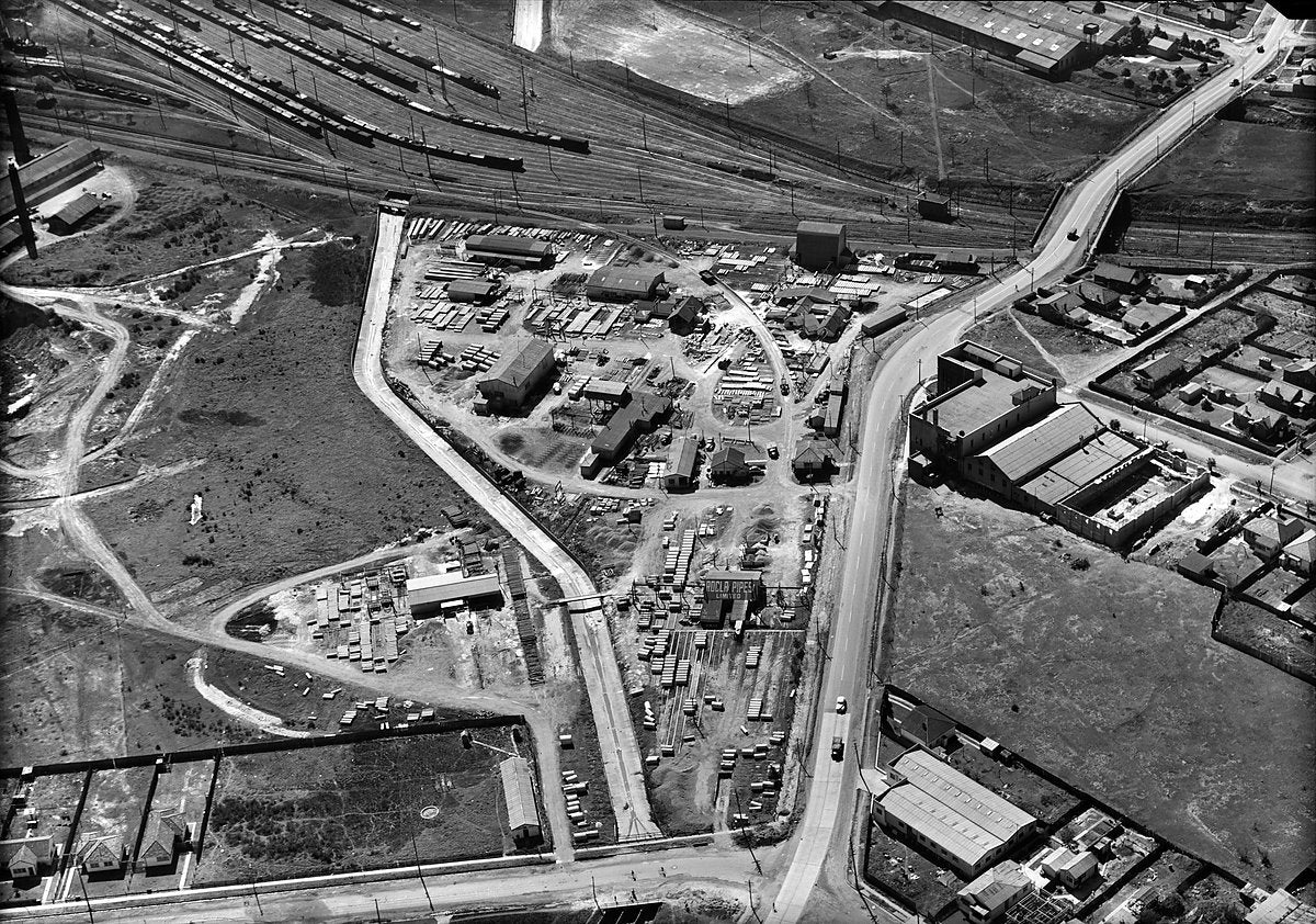 Rocla Pipes works and railway sidings, aerial view — photograph, c. 1950