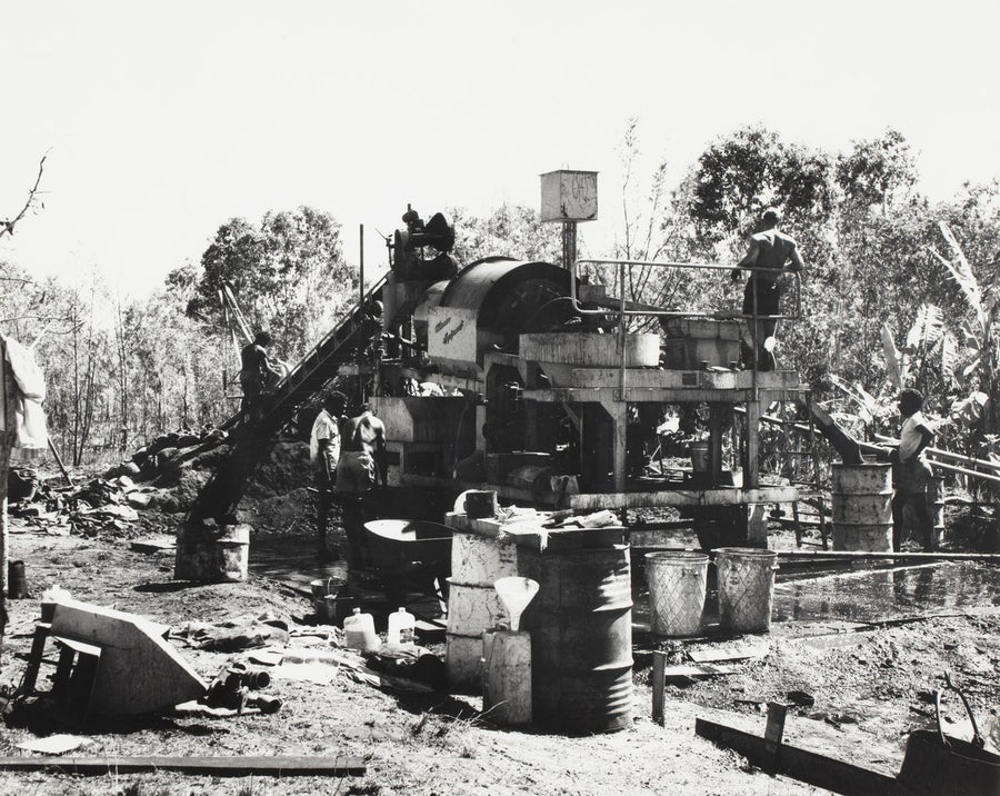 Men operating a mobile crushing plant in cleared bushland, New South Wales — photograph, circa 1979