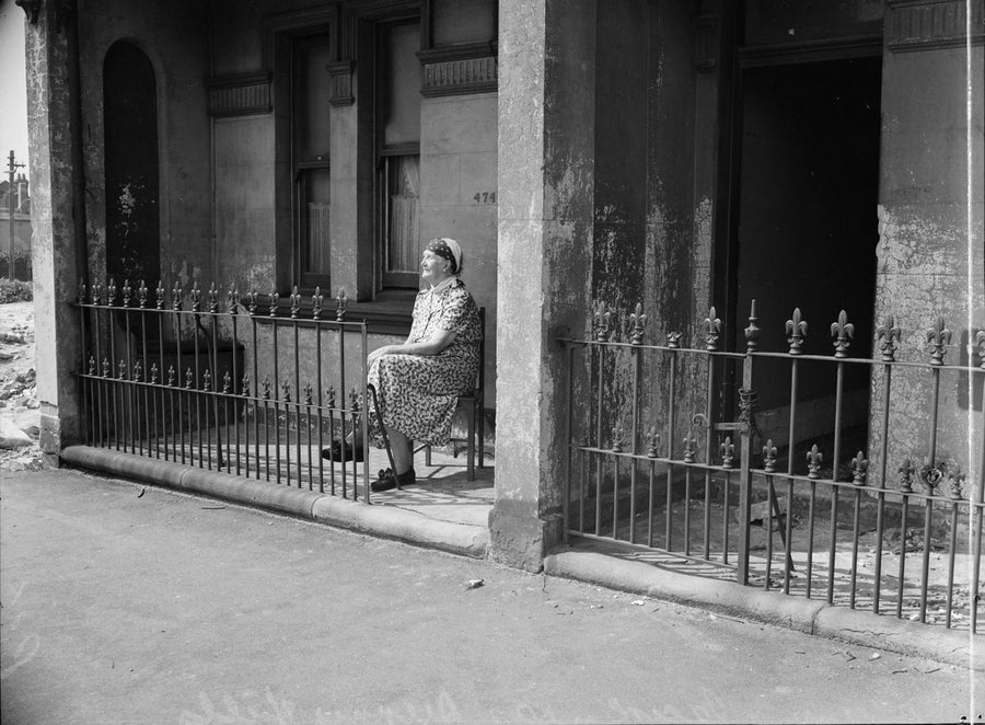 Seated outside number 474, Surry Hills, 1950 — photograph, from Surry Hills, circa 1950