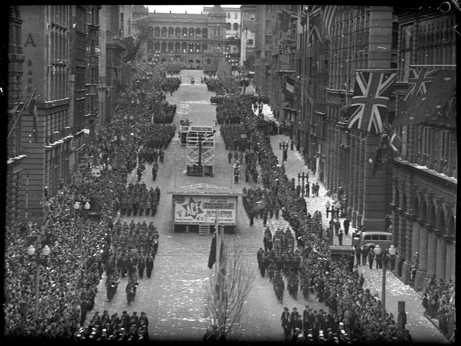 Victory parade and crowds for the end of the Second World War, Martin Place, Sydney, 1945 — photograph, from Martin Place, Sydney, circa 1945