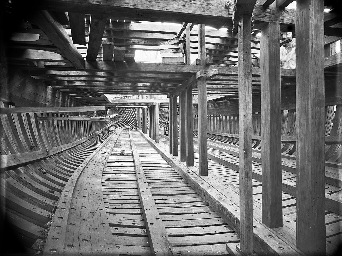 Hull framing under construction, Kidman & Mayoh shipyard, Kissing Point, Ryde — photograph, from Kissing Point, c. 1920–25
