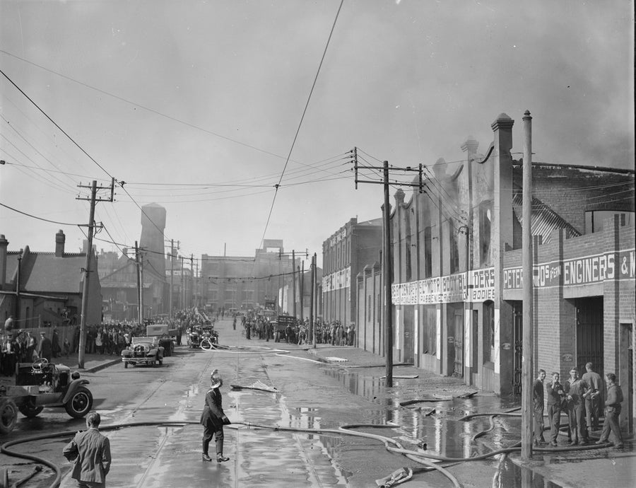 Fire brigade at Bryden & Peters Motor Body Builders, Phillip Street, Redfern — photograph, from Phillip Street, circa 1934