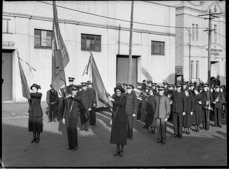 Salvation Army flag bearers and band outside the Newtown citadel, 1942 — photograph, from Salvation Army Citadel, Newtown, circa 1942