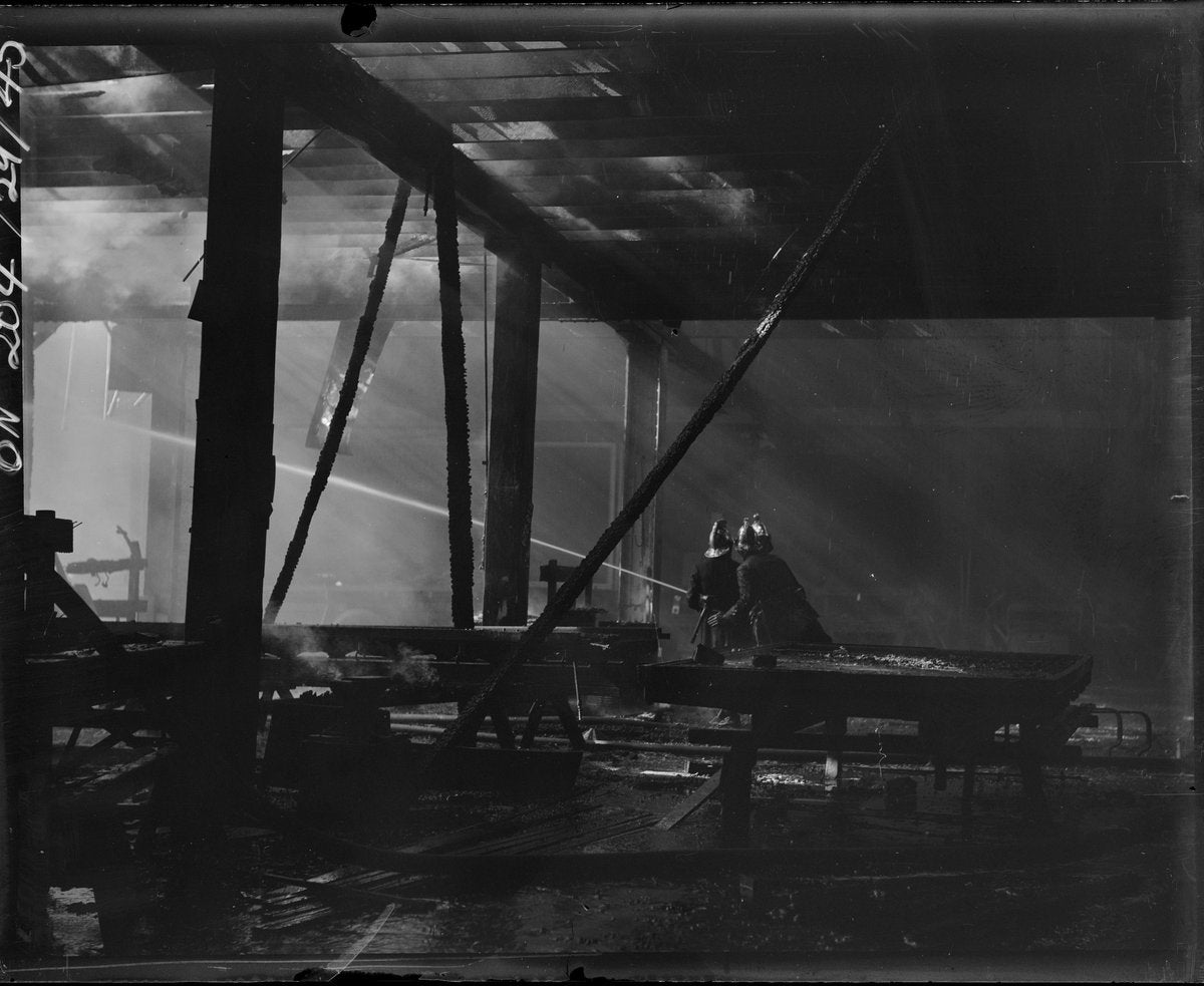Firefighters at the Bryden & Peters fire, Phillip Street, Redfern — photograph, from Bryden & Peters Motor Body Builders, Phillip Street, Redfern, circa 1934