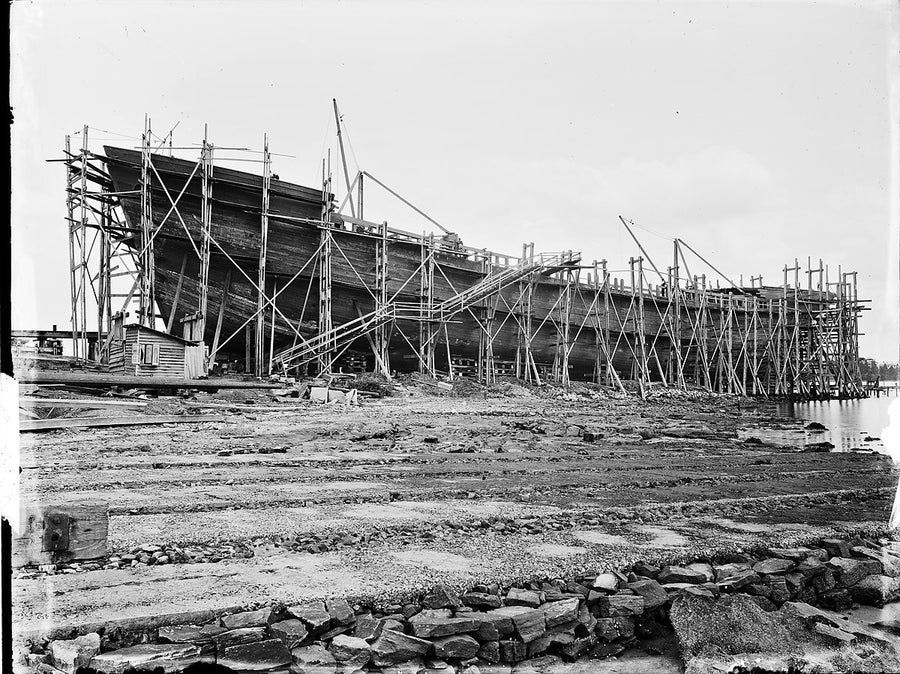 Wooden ship on the stocks at Kidman & Mayoh's shipyard, Kissing Point — photograph, from Kissing Point, c. 1920–25