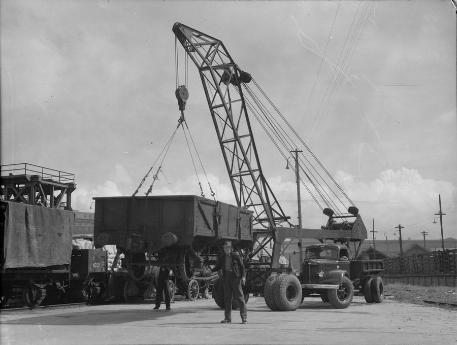 White truck crane lifting a railway goods wagon, Sydney — photograph, from Sydney, circa 1935