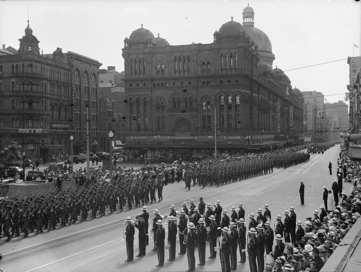 2nd AIF infantry on parade past the Queen Victoria Building, George Street — photograph, from Queen Victoria Building, circa 1940
