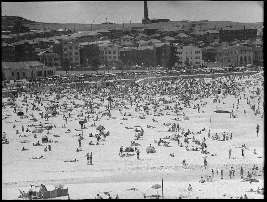 Crowds on Bondi Beach below the promenade, c.1950 — photograph, from Bondi Beach, Sydney, circa 1950
