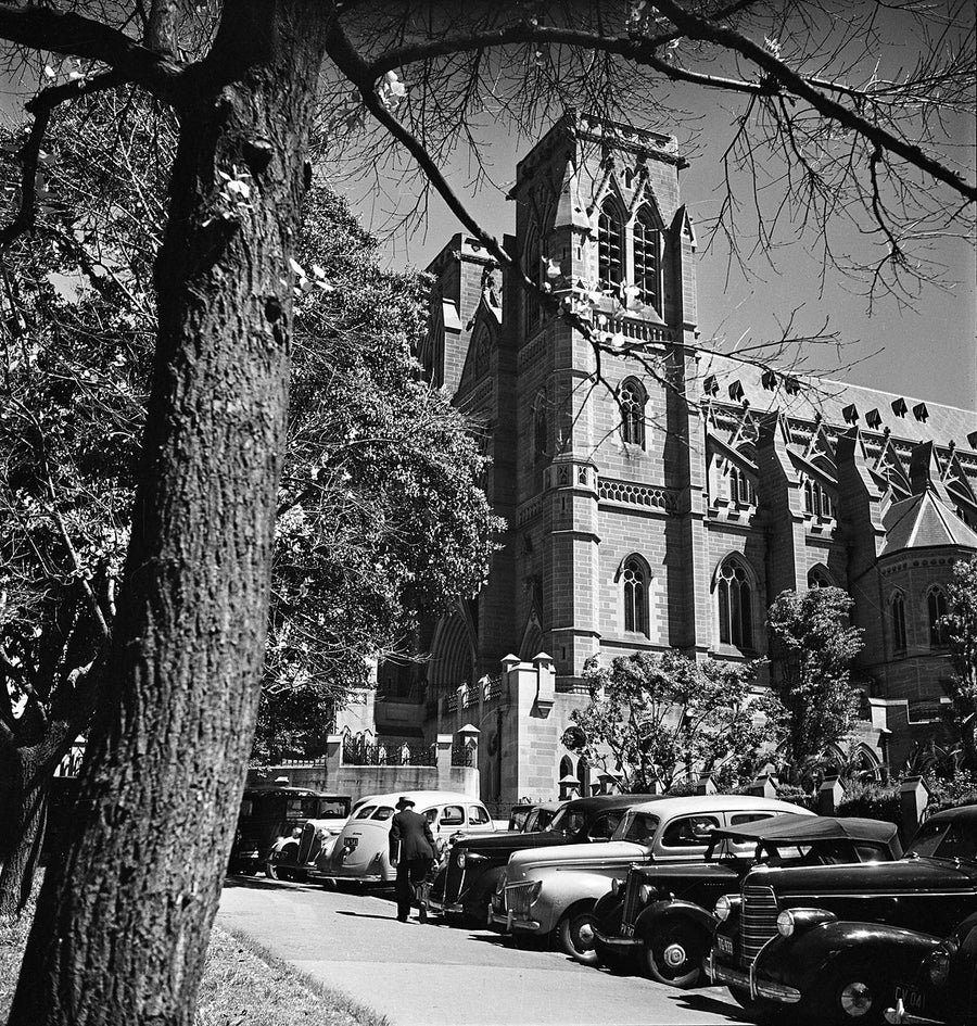 St Mary's Cathedral and parked cars, Sydney — photograph, from St Mary's Cathedral, c. 1940