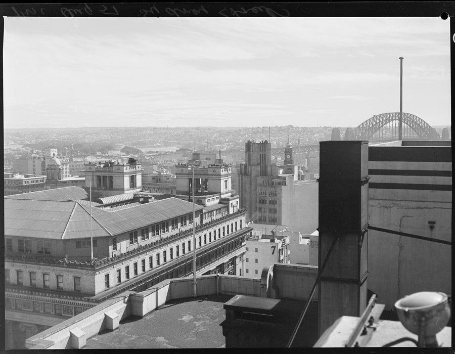 Rooftop view across the Sydney city centre to the Harbour Bridge, 1951 — photograph, from Sydney central business district, looking towards Sydney Harbour Bridge, circa 1951
