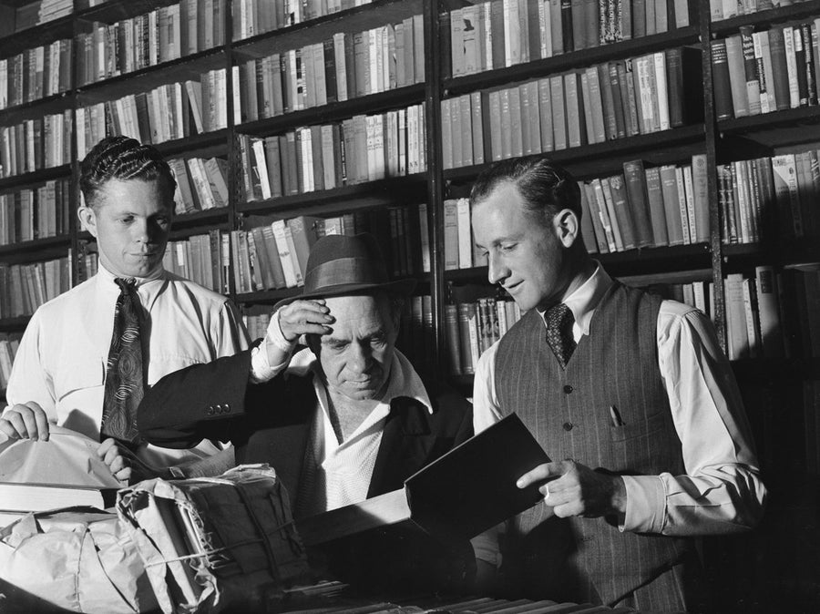 Sorting books at a Marrickville book collection, 1949 — photograph, from Marrickville, circa 1949
