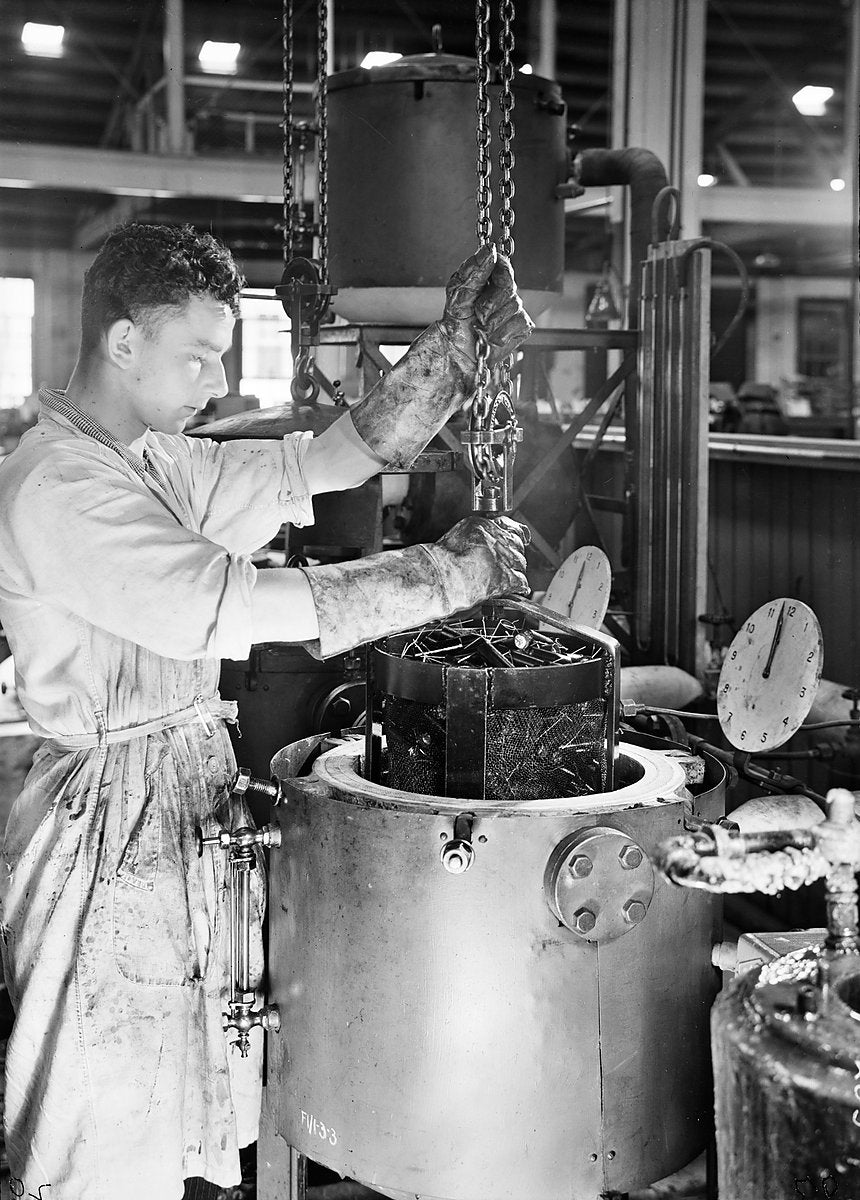 Loading a parts basket at the AWA factory, Ashfield — photograph, from Ashfield, c. 1940s