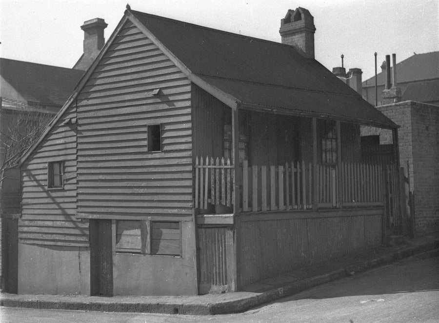 Weatherboard cottage on a sloping street, Surry Hills or Redfern, 1930 — photograph, circa 1930