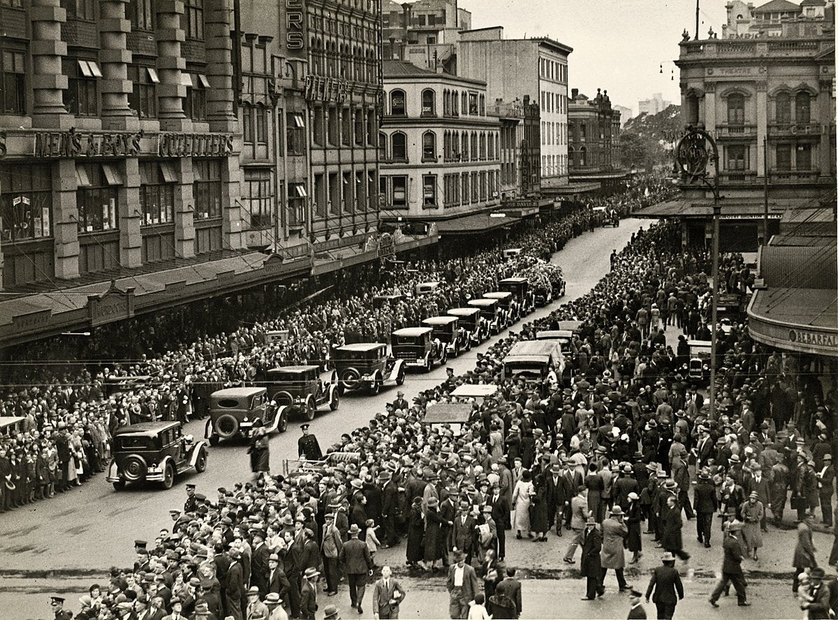 Motorcade passing Gowings on George Street, Sydney — photograph, from Gowings Building, circa 1938