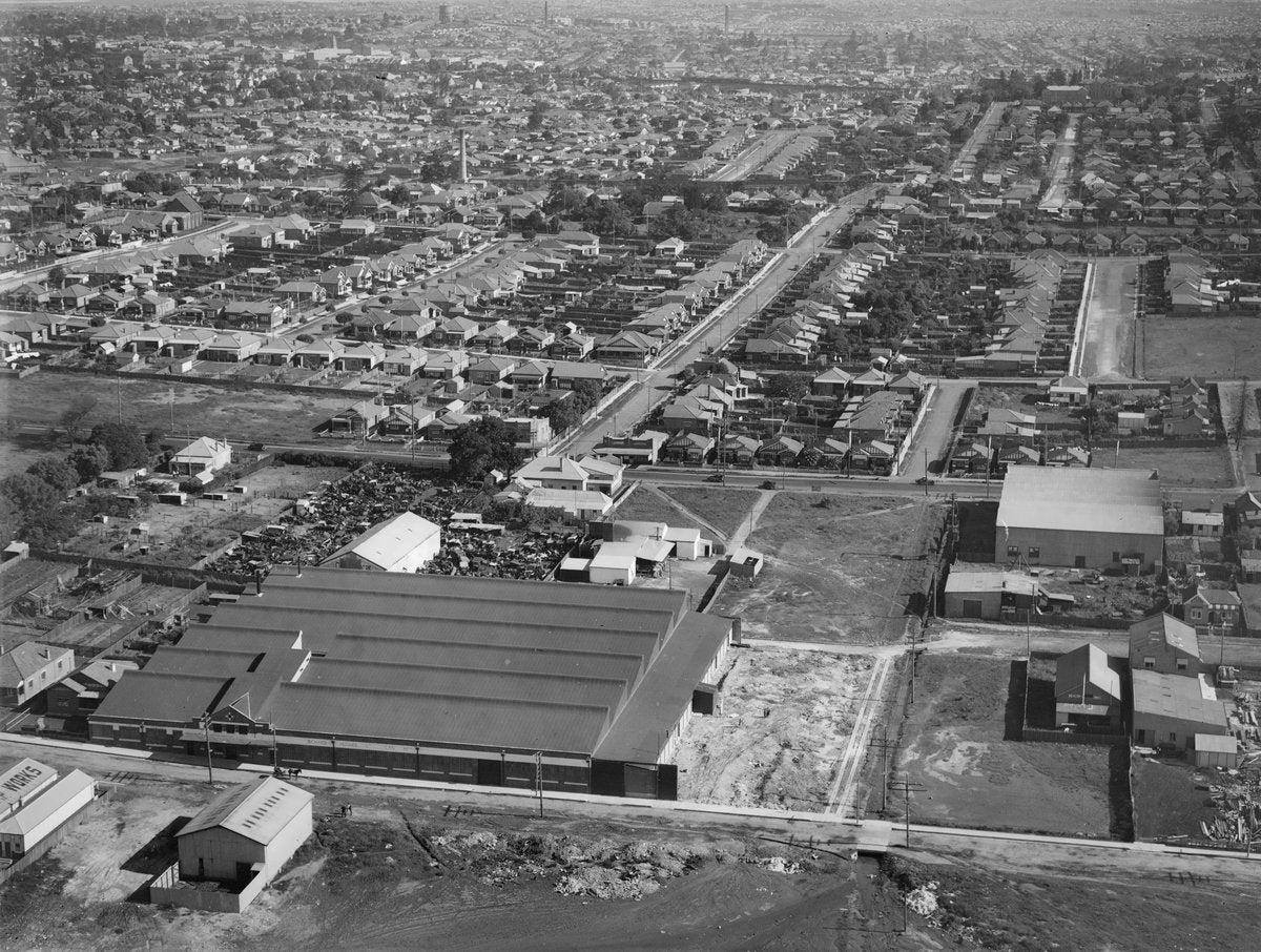 Richard Hughes can works, Queens Road, Five Dock, from the air — photograph, from Queens Road, circa 1930