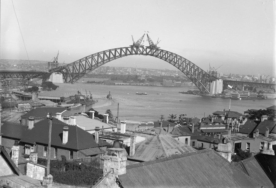 Sydney Harbour Bridge under construction, the arch nearly joined, c. 1930 — photograph, from Sydney Harbour Bridge, circa 1930
