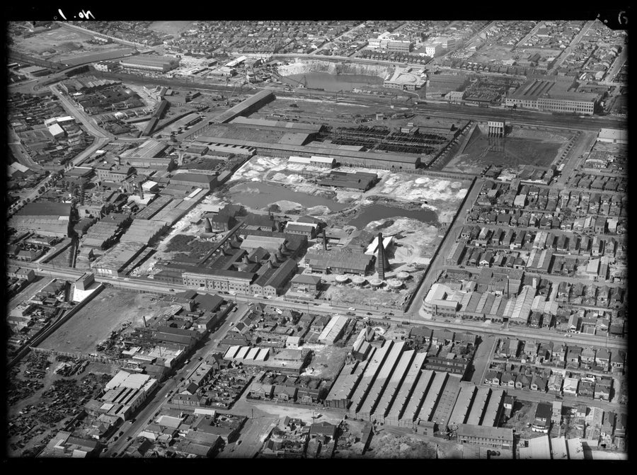 Pottery works and surrounding industrial district, aerial view — photograph, circa 1950